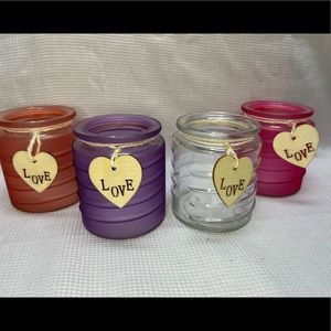 Valentines Day 4 piece, glass love candle holder set holds votive candles.
